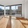 Living room with windows all around and a window air unit