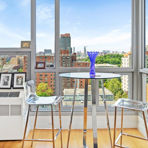 Dining space surrounded by large windows